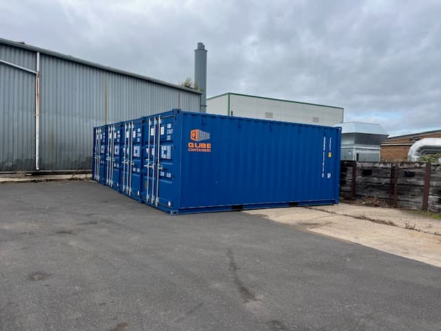 Blue steel storage containers on site